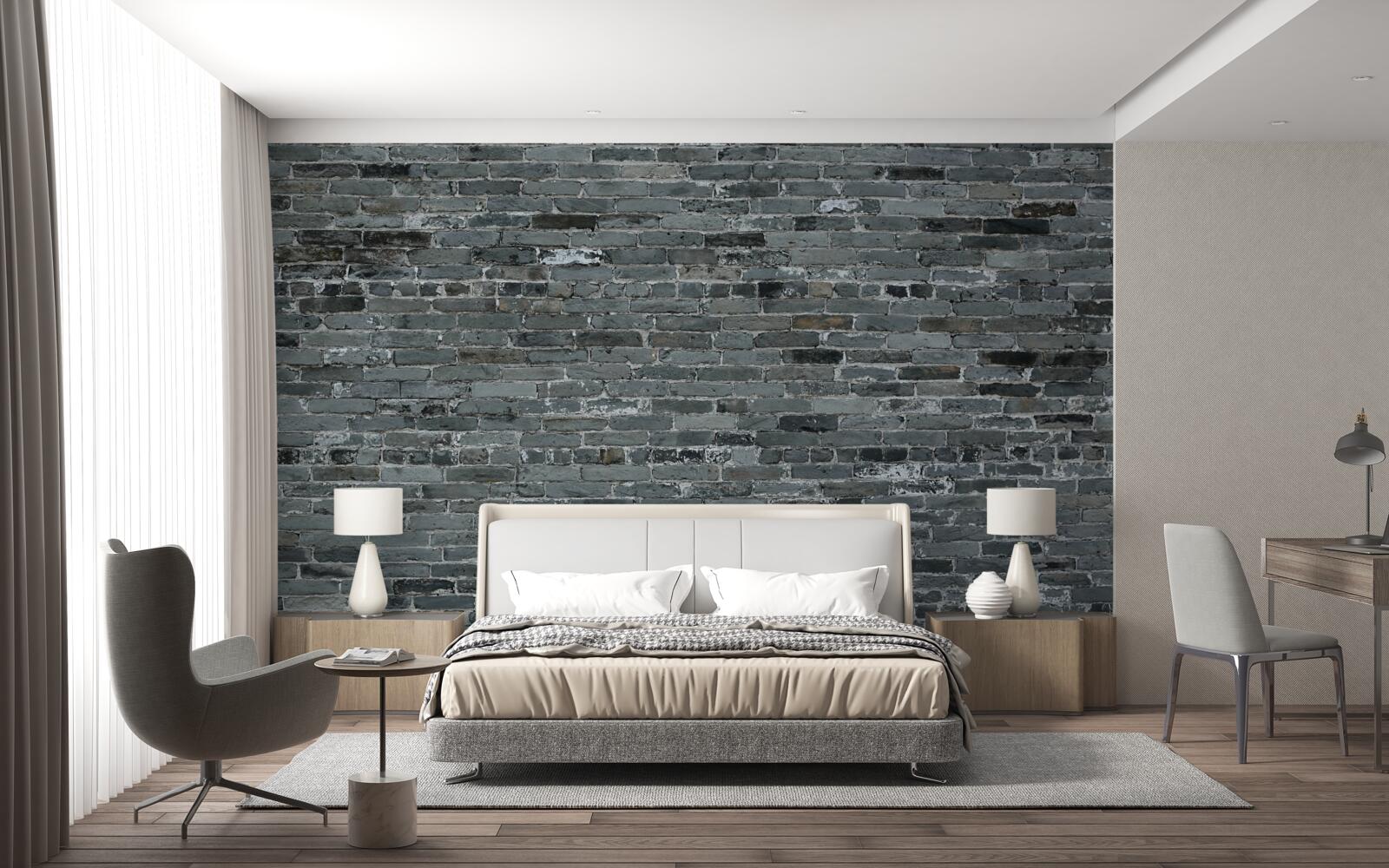 Papier peint Le mur en briques est de couleur gris foncé.