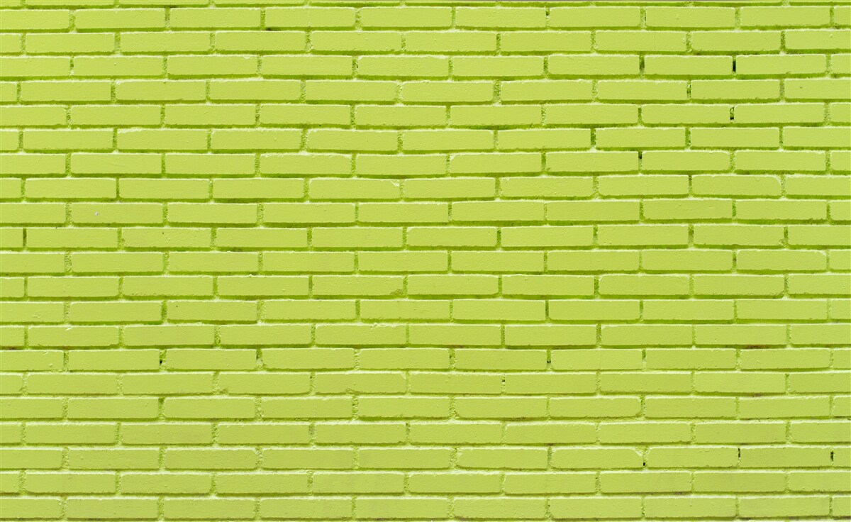 Papier peint Mur de briques dans une teinte vert clair