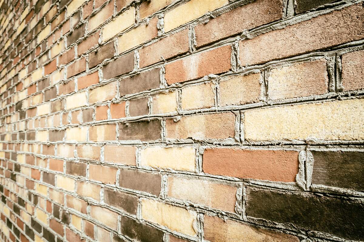 Papier peint vue latérale d'un mur de briques