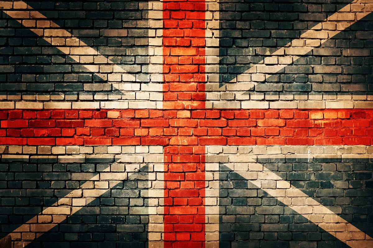 Papier peint drapeau britannique sur un mur de briques