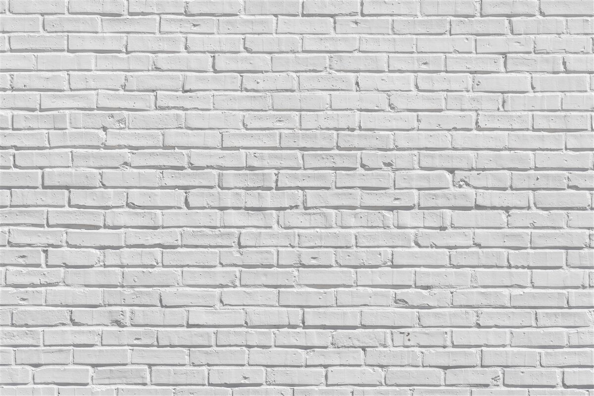 Papier peint Le mur de briques est peint en blanc