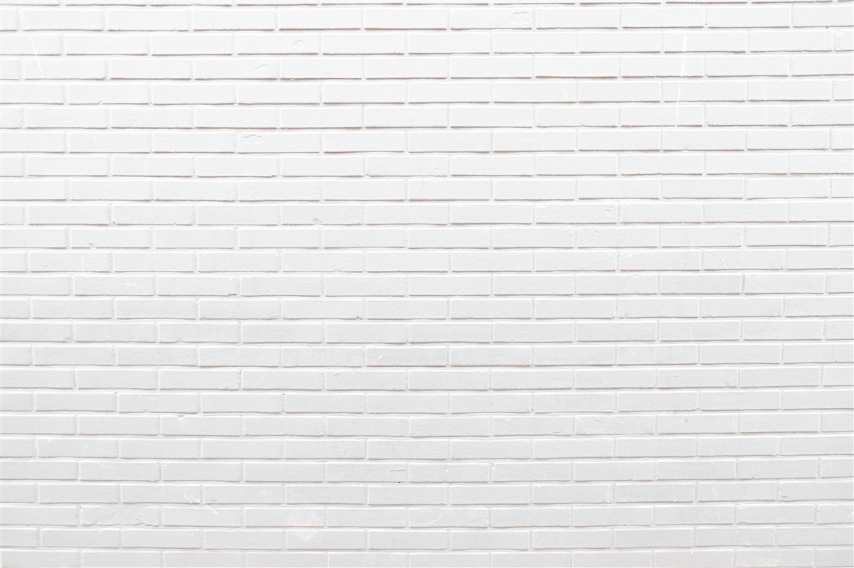 Papier peint le mur de briques est d'un blanc immaculé