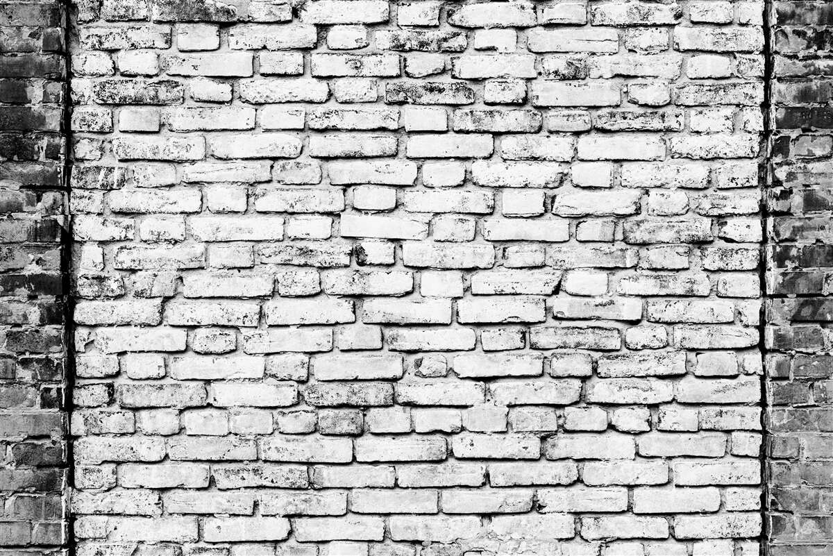 Papier peint Mur de briques avec traces de rayures