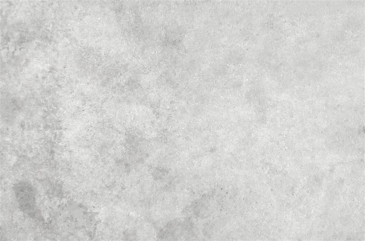 Papier peint Le mur est en béton de couleur gris clair.