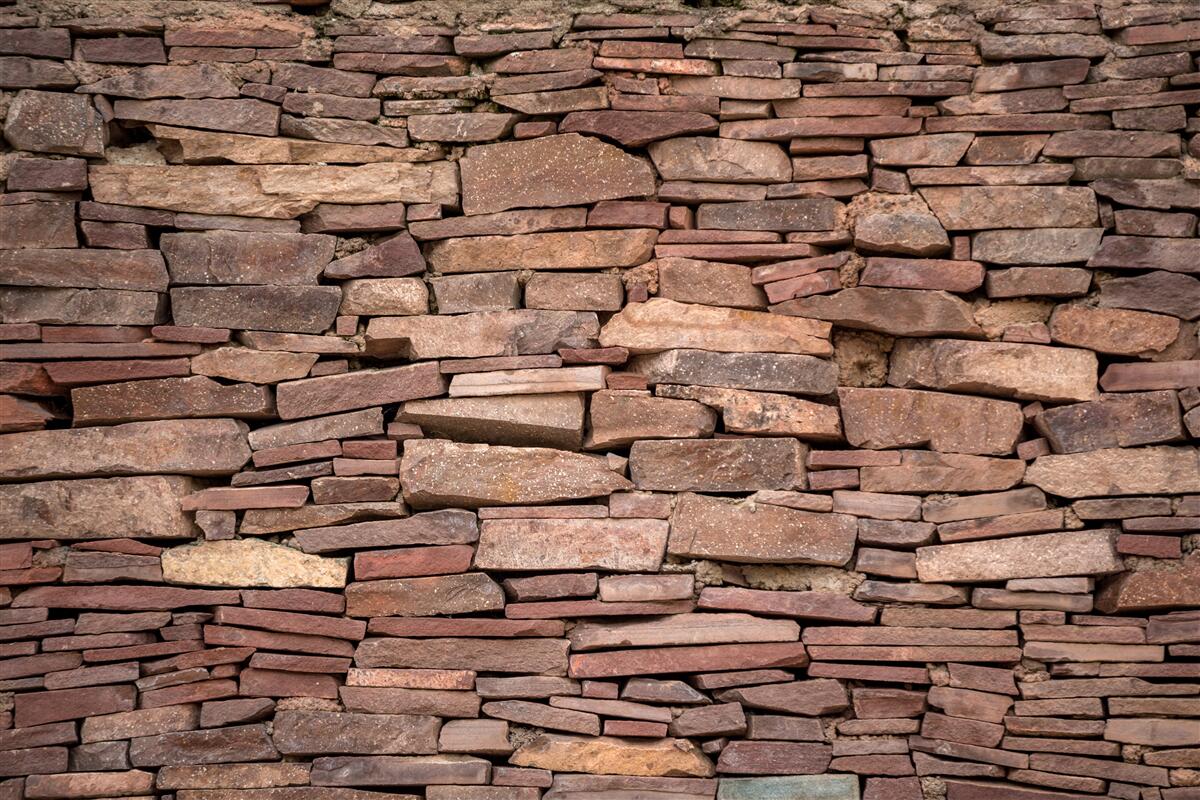 Papier peint barrière de pierre brune à texture irrégulière