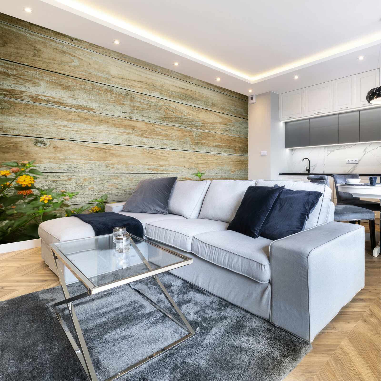 Papier peint fleurs jaunes sur fond de parquet entouré de verdure