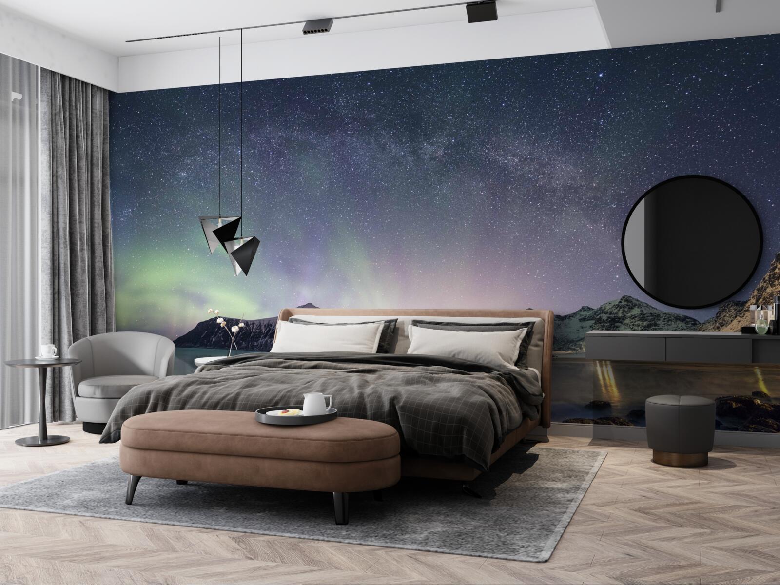 Papier peint le ciel nocturne décoré d'étoiles et illuminé par les aurores boréales