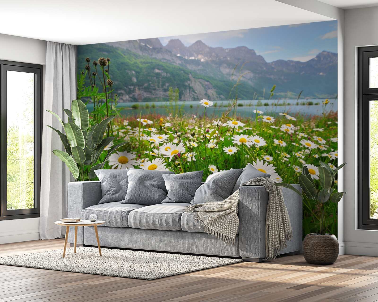 Papier peint paysage avec champ de camomille au pied des montagnes