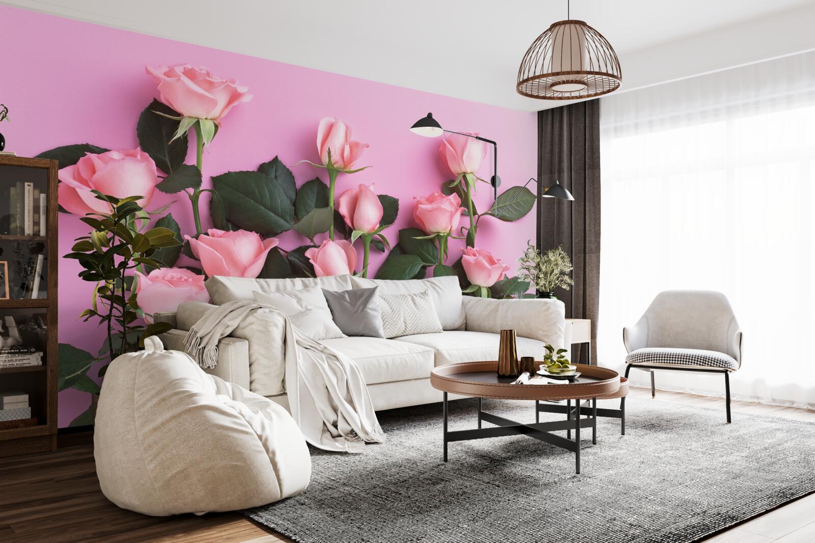 Papier peint roses délicates sur fond rose uni