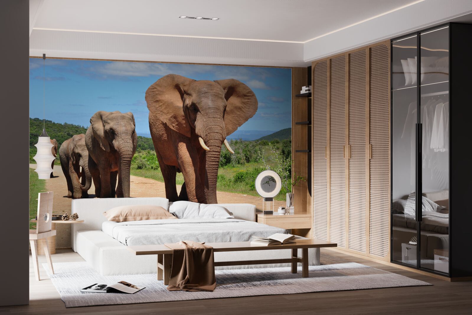 Papier peint Un groupe d'éléphants rentre chez lui en traversant un terrain sablonneux.