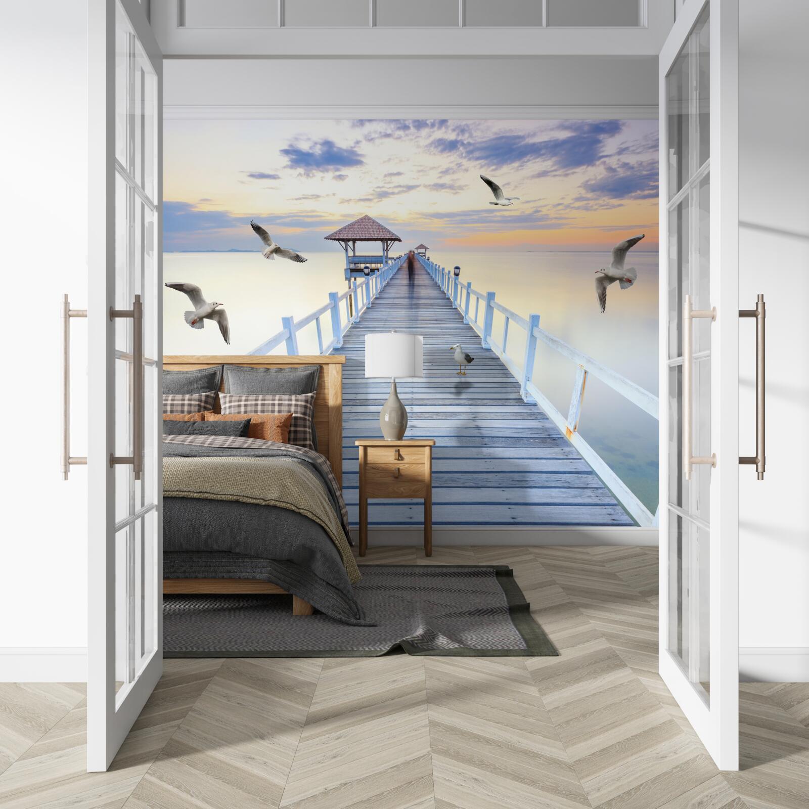 Papier peint pont en bois menant à l'océan