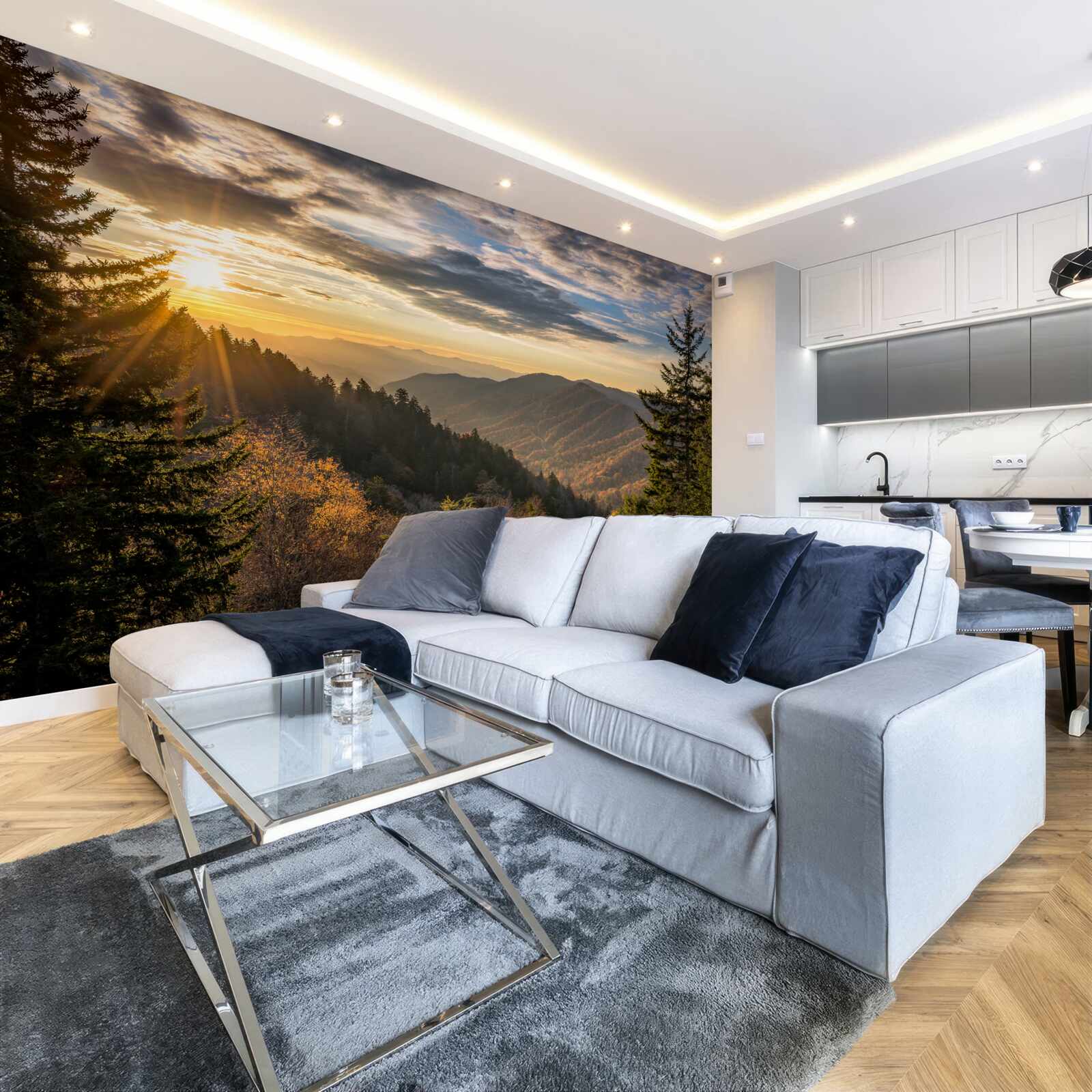 Papier peint le soleil couchant sur les sommets des montagnes