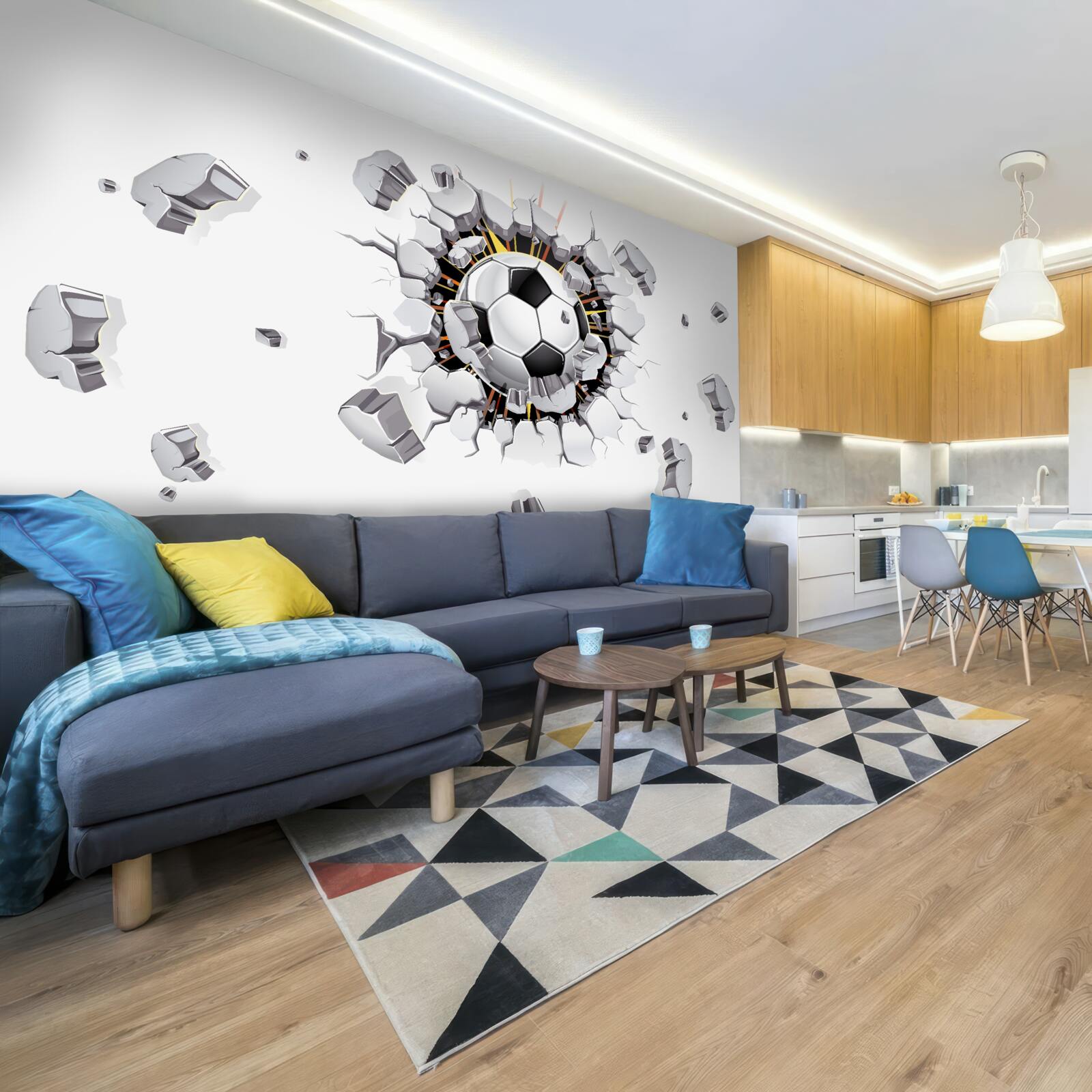 Papier peint Le mur a été percé avec un ballon de football