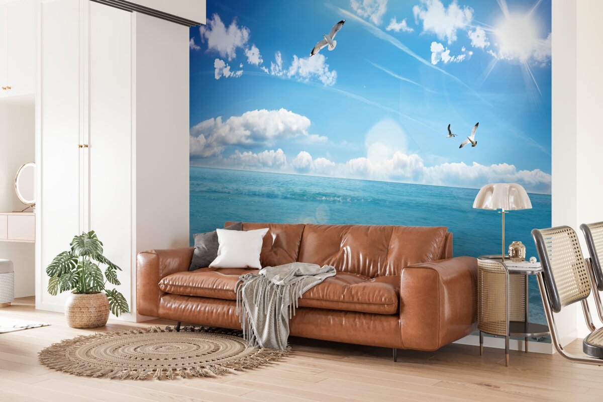 Papier peint mouettes sur les vagues bleues