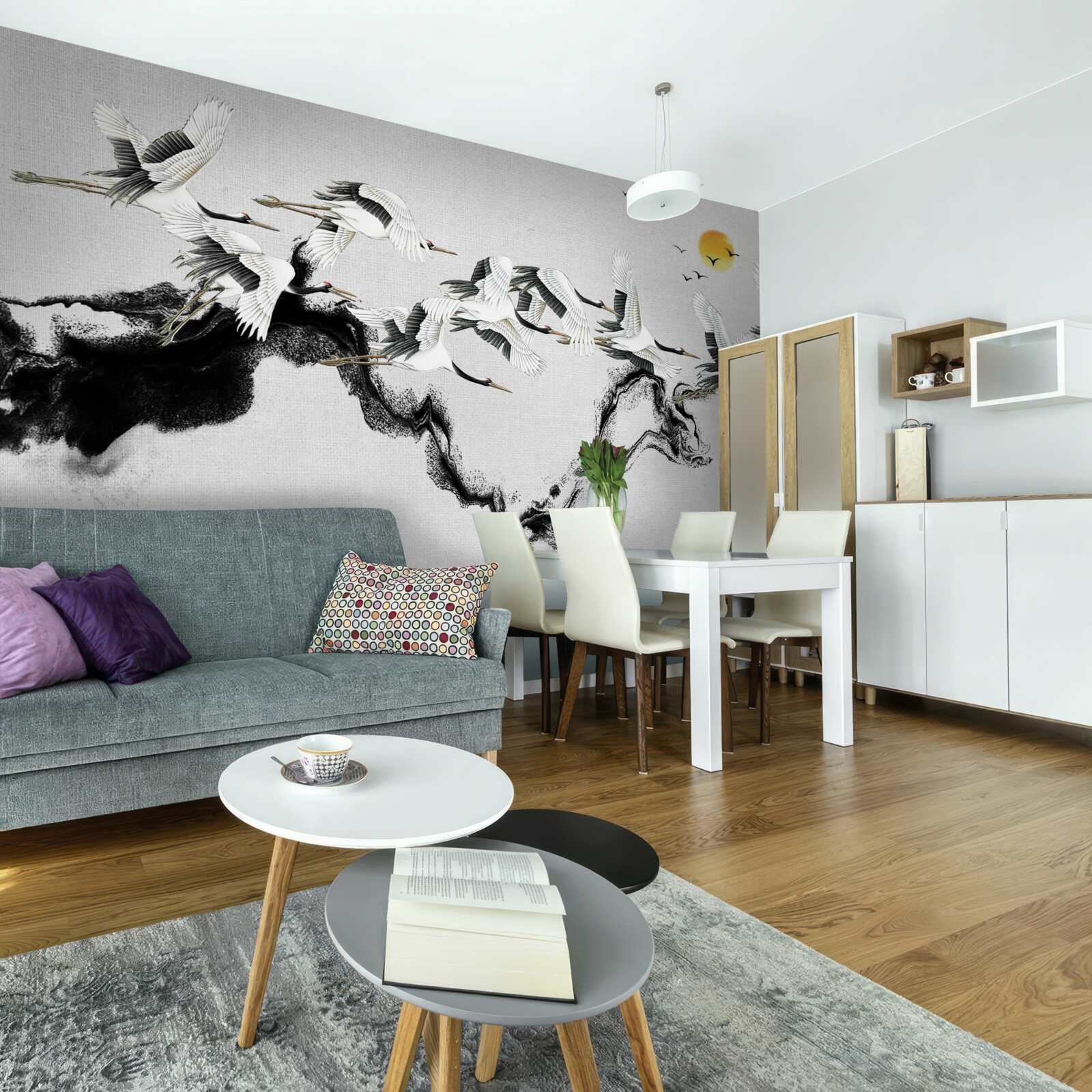 Papier peint groupe de grues japonaises planant vers le coucher du soleil