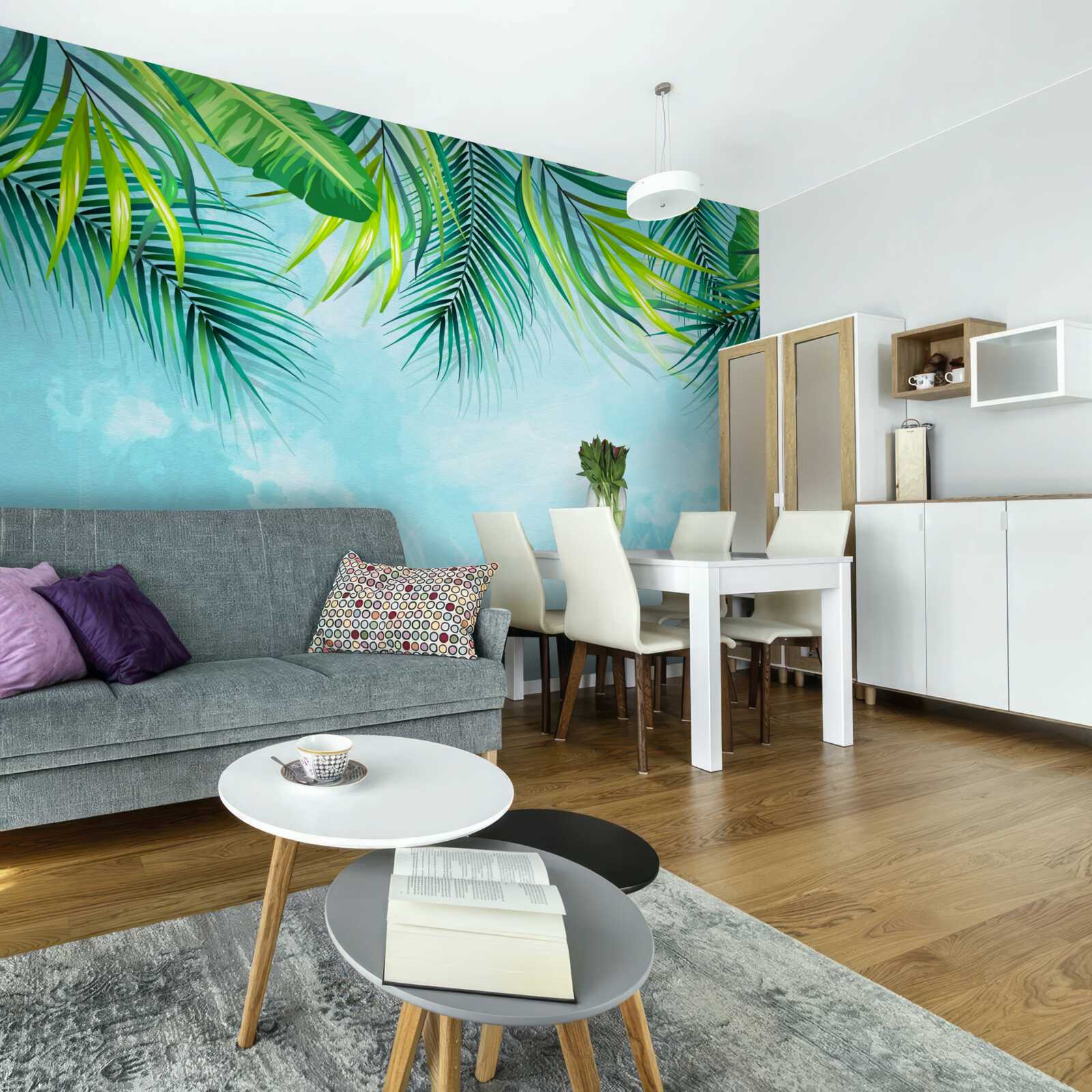 Papier peint feuilles tropicales sur fond de ciel bleu