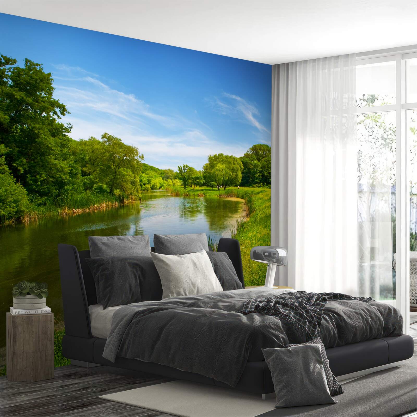 Papier peint une prairie verte traversée par une eau calme