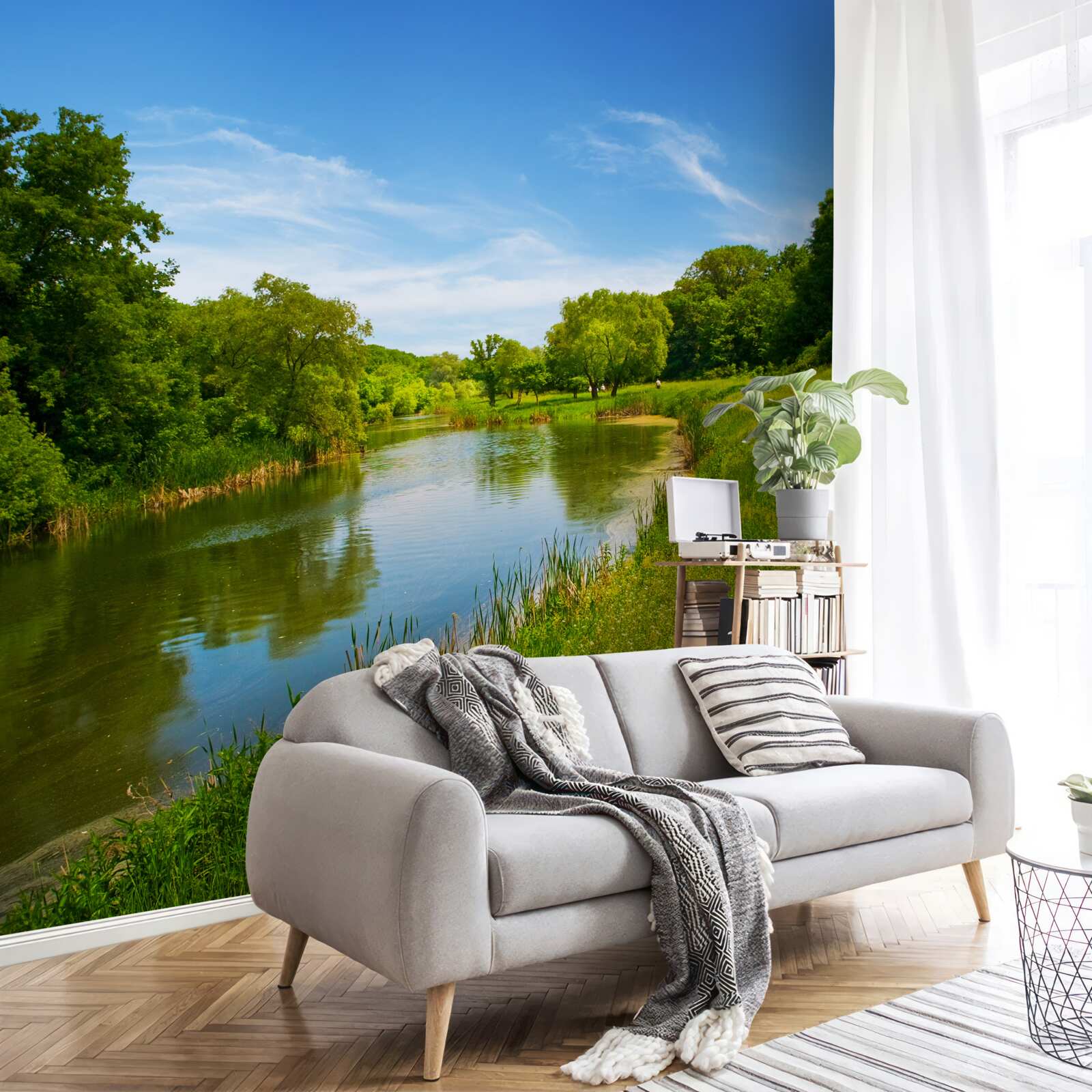 Papier peint une prairie verte traversée par une eau calme