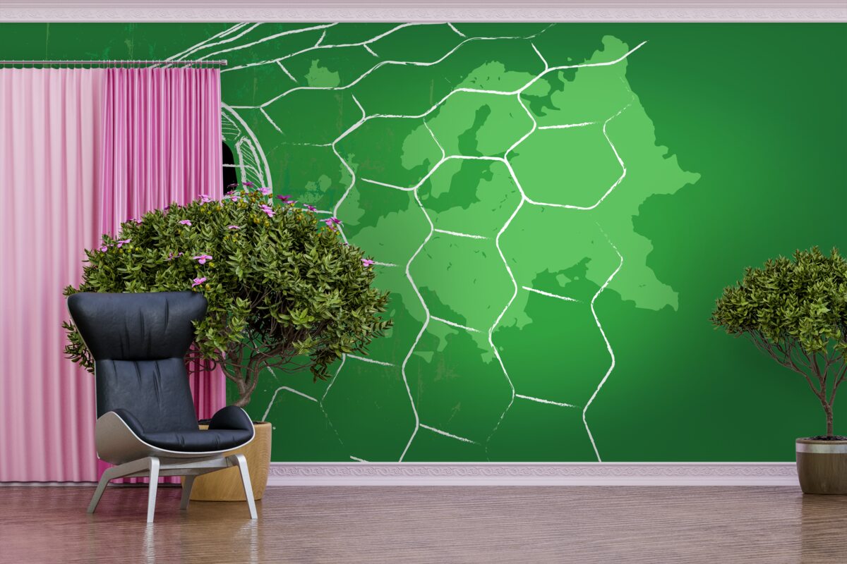 Papier peint silhouette d'un ballon de football et d'un filet se détachant sur un fond vert