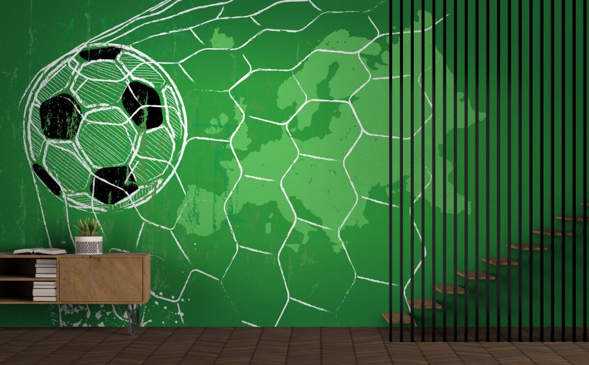 Papier peint silhouette d'un ballon de football et d'un filet se détachant sur un fond vert