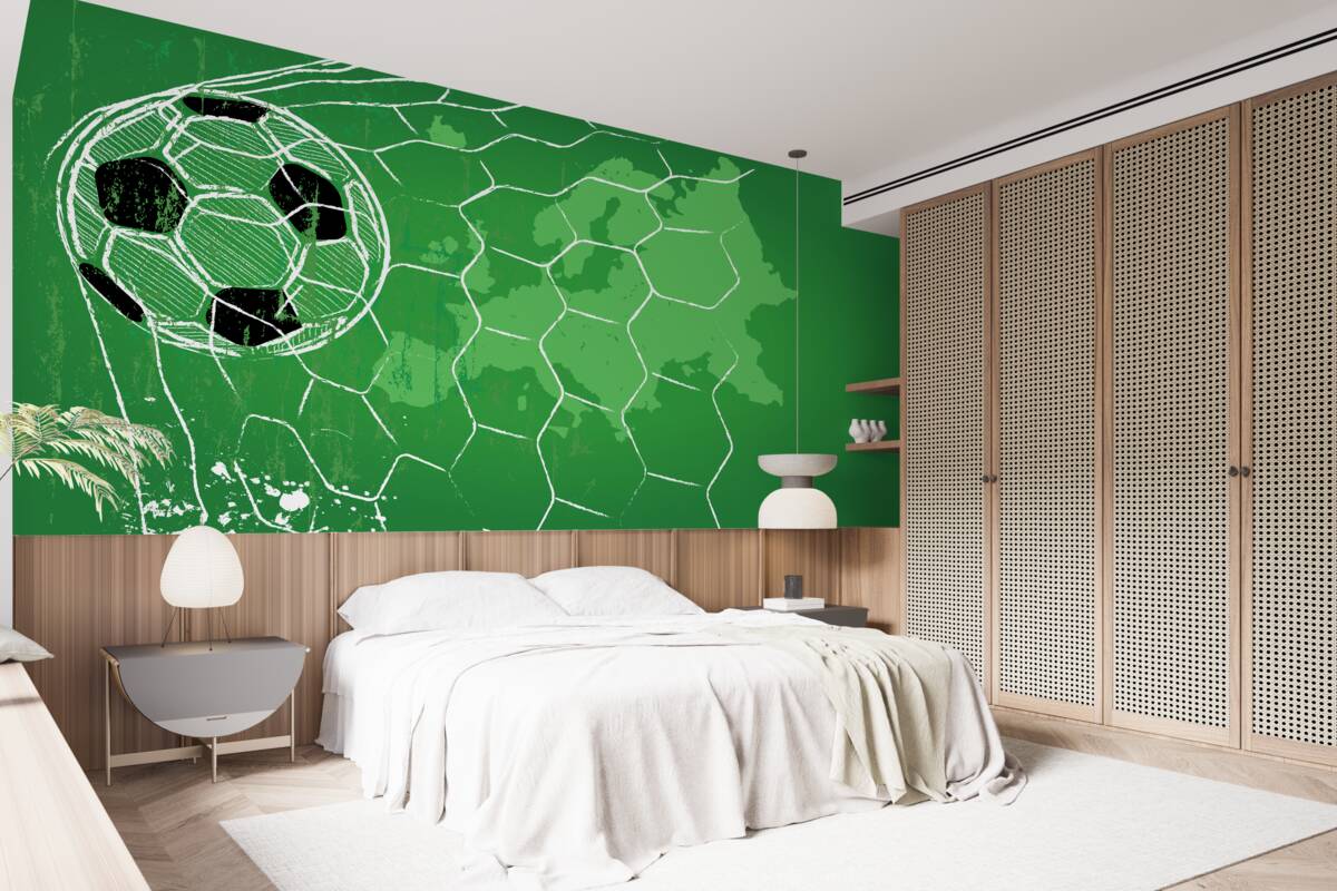 Papier peint silhouette d'un ballon de football et d'un filet se détachant sur un fond vert