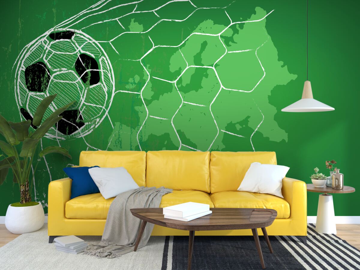 Papier peint silhouette d'un ballon de football et d'un filet se détachant sur un fond vert