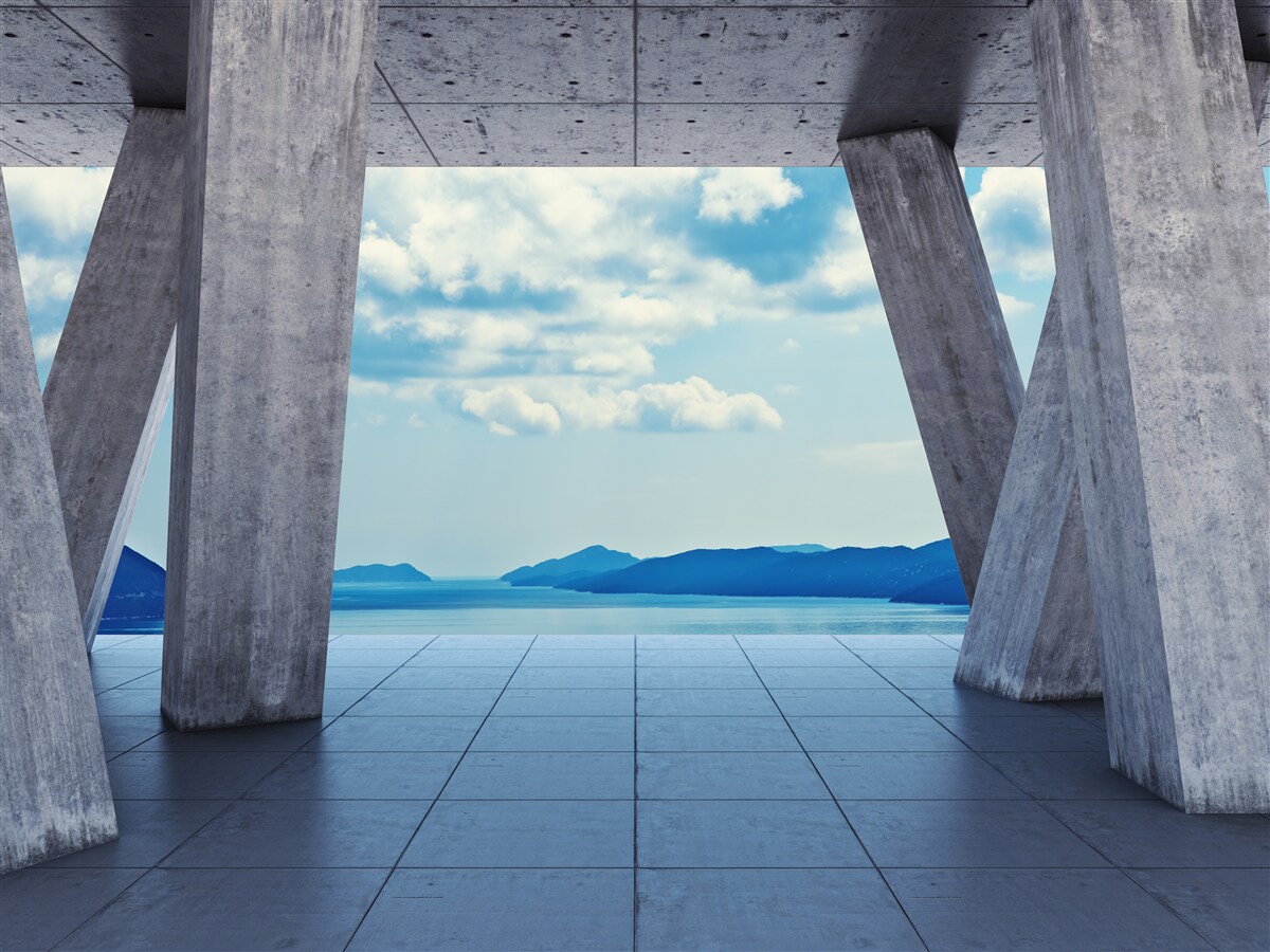 Papier peint Arches en béton ouvrant un panorama de montagnes et de ciel