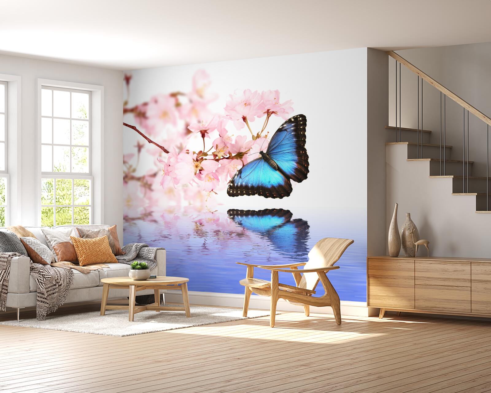 Papier peint un papillon bleu se pose sur un cerisier près de l'eau