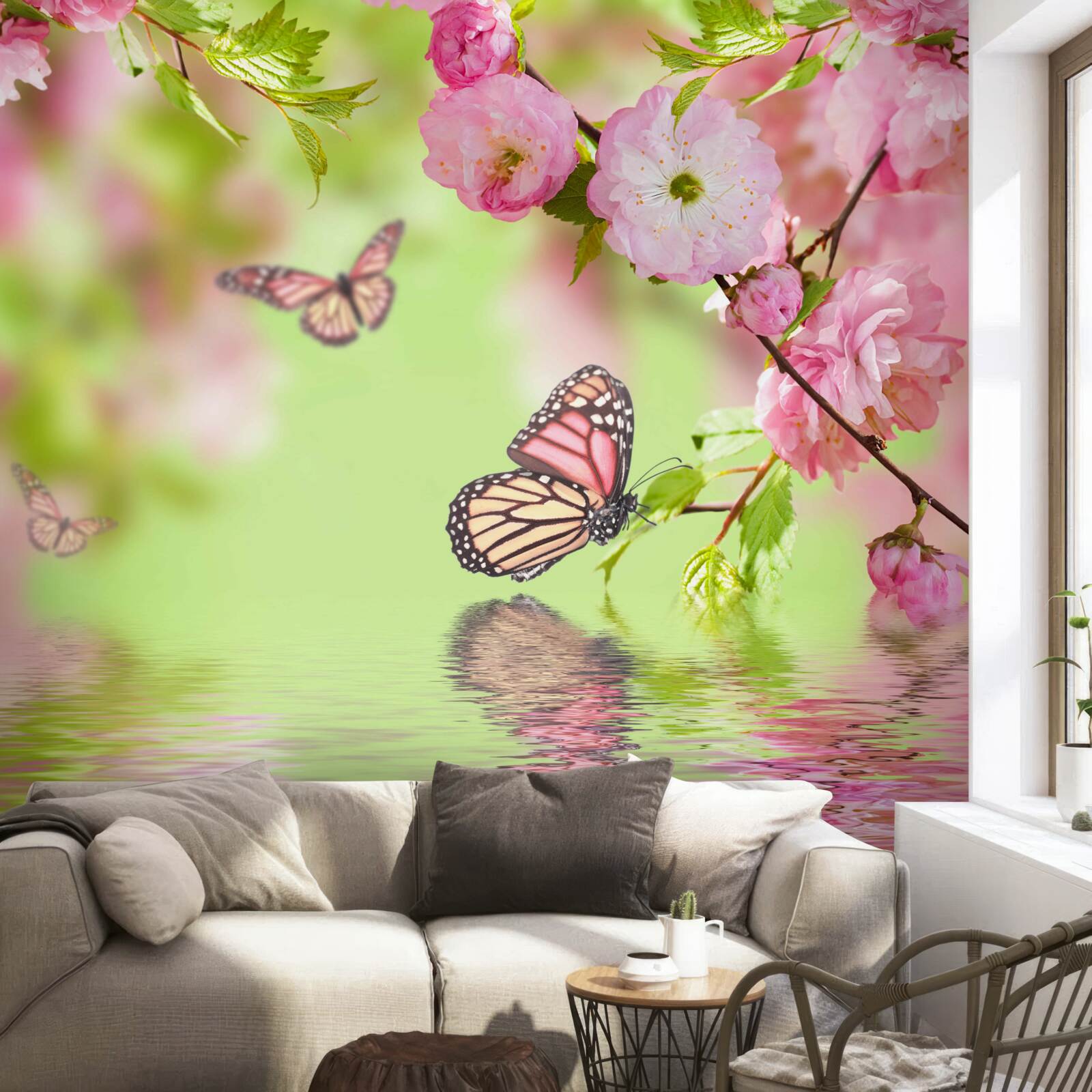 Papier peint des papillons se posent sur un cerisier en fleurs près d'un étang