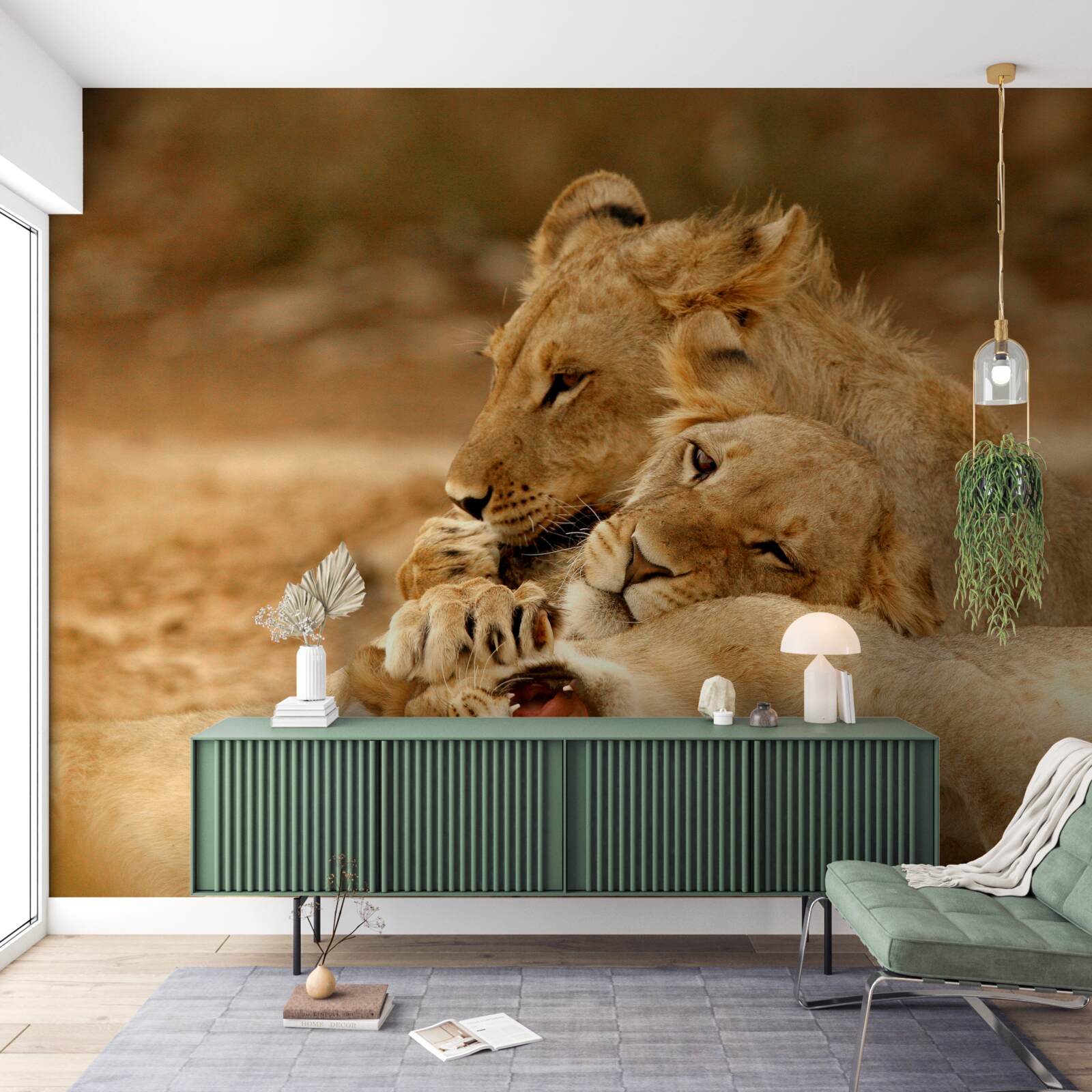 Papier peint une famille de lions s'est installée sur une surface sablonneuse