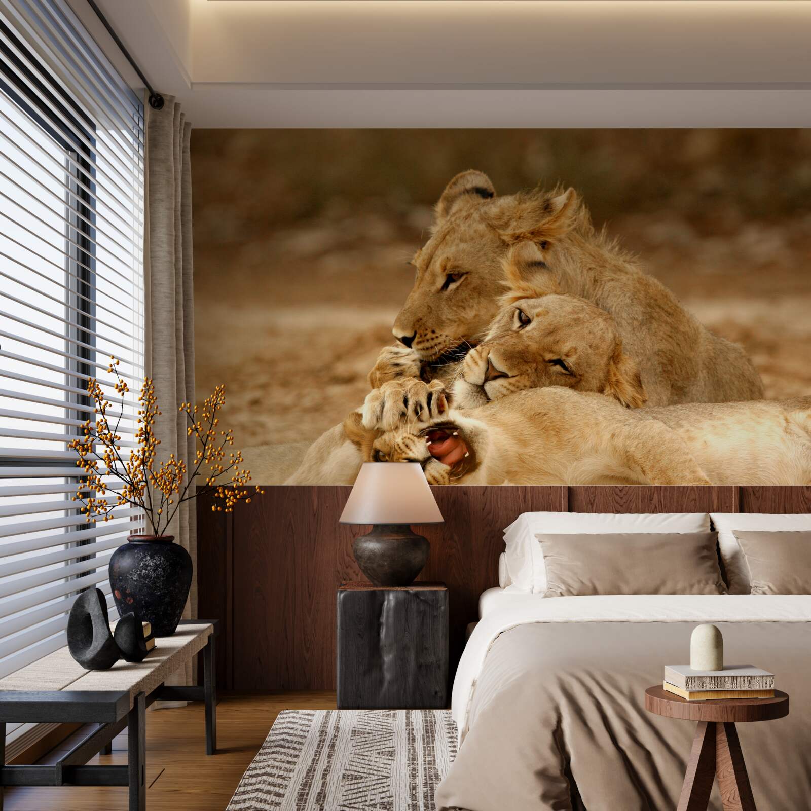 Papier peint une famille de lions s'est installée sur une surface sablonneuse