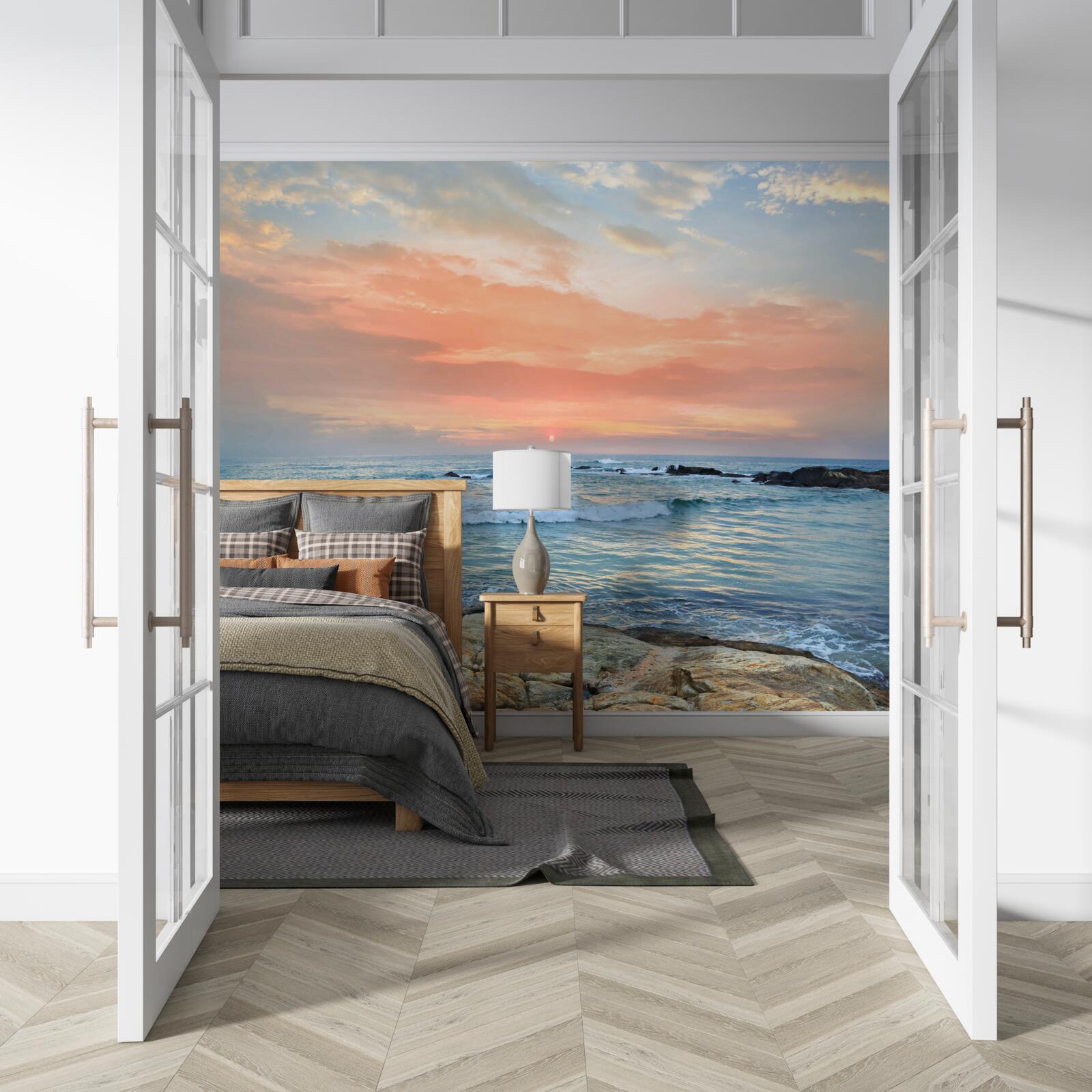 Papier peint l'océan qui s'étend jusqu'à l'horizon et un coucher de soleil rose