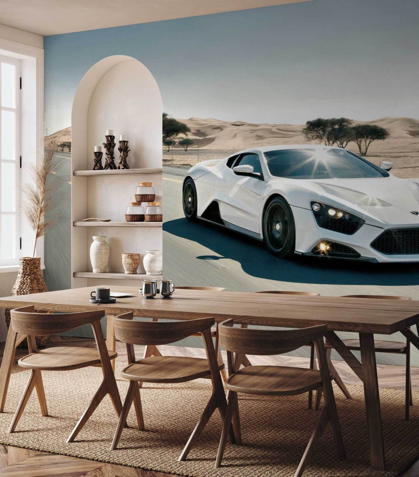 Papier peint une voiture de sport blanche roule sur une route vide