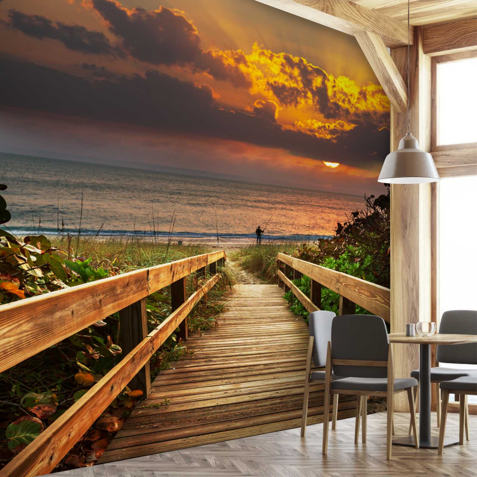 Papier peint le soleil se couche sous l'horizon au bord de la mer