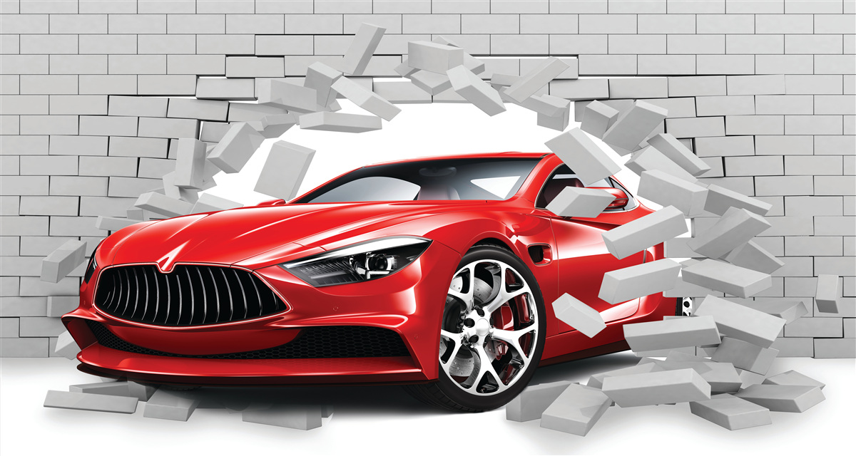 Papier peint Une voiture rouge frappe un mur de briques
