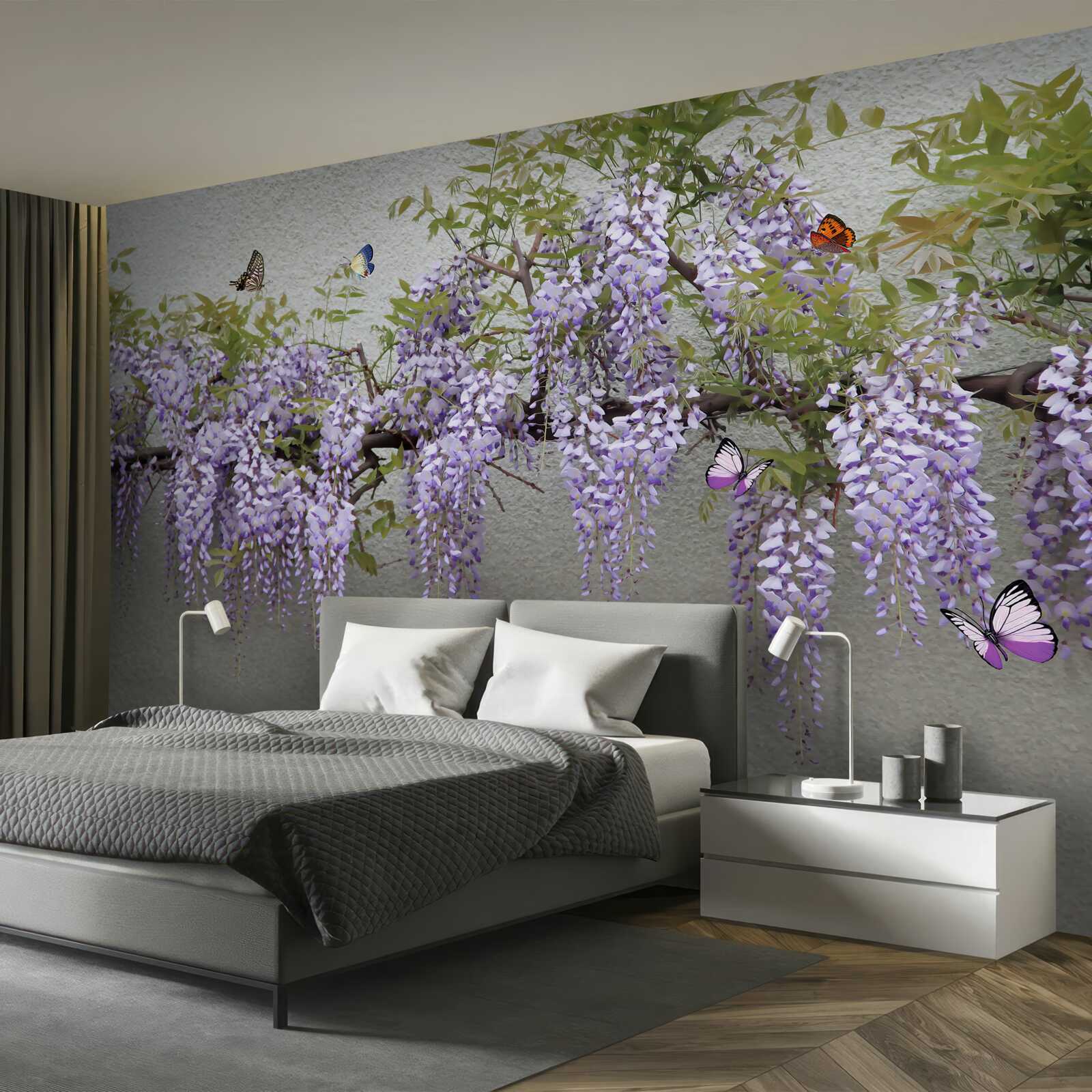 Papier peint une branche avec des fleurs de lilas et des papillons qui voltigent