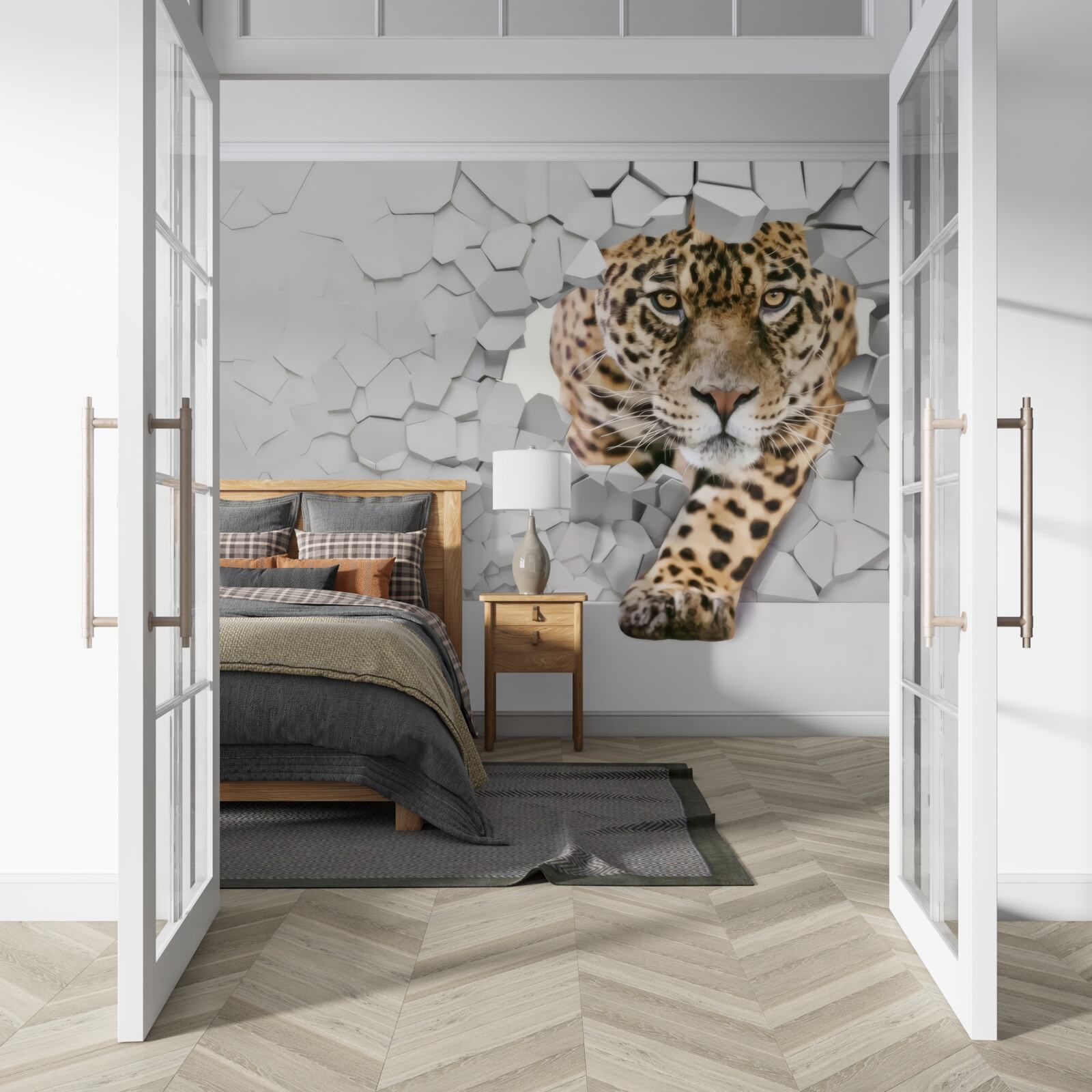 Papier peint un léopard émerge d'un mur blanc