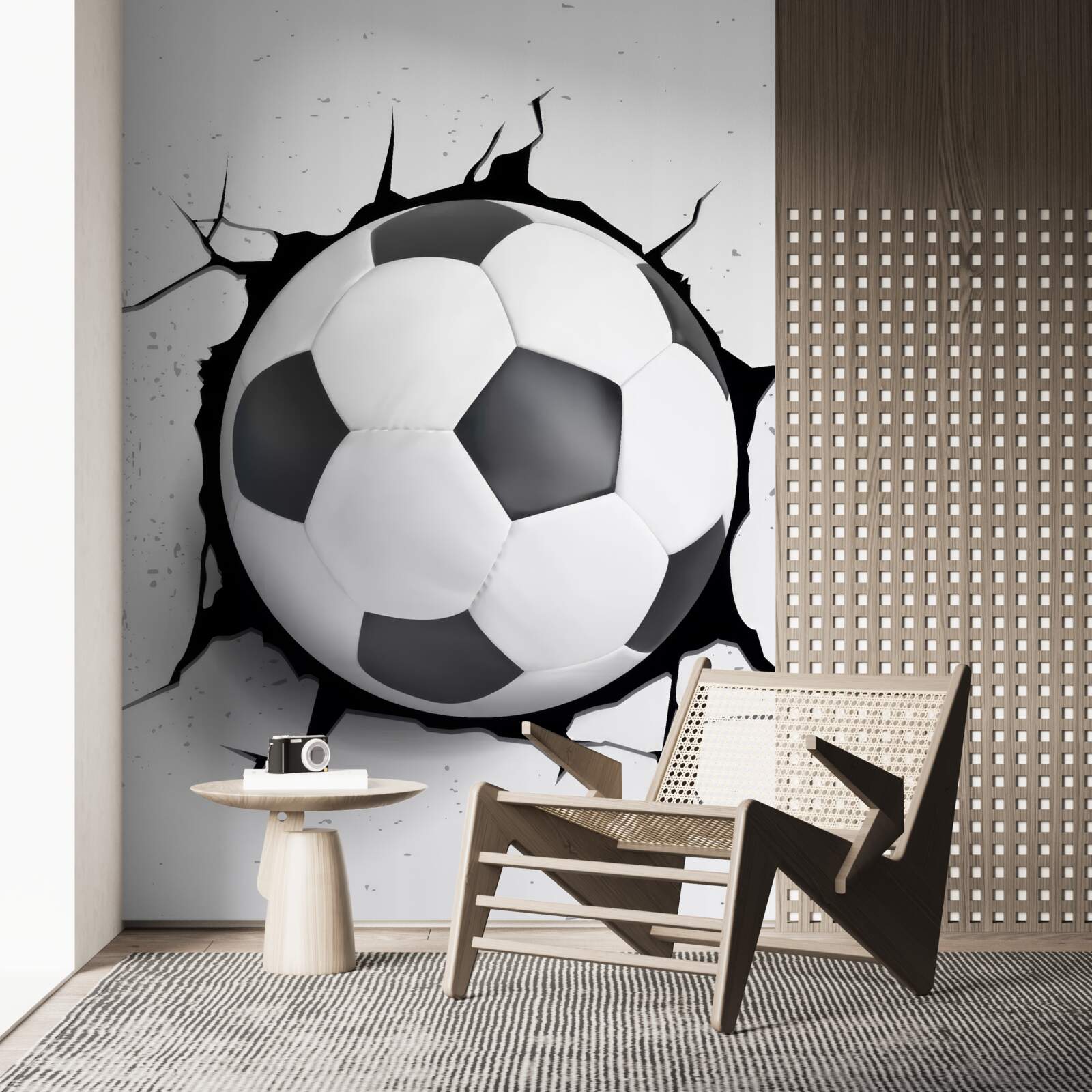 Papier peint un ballon de football dépasse du mur