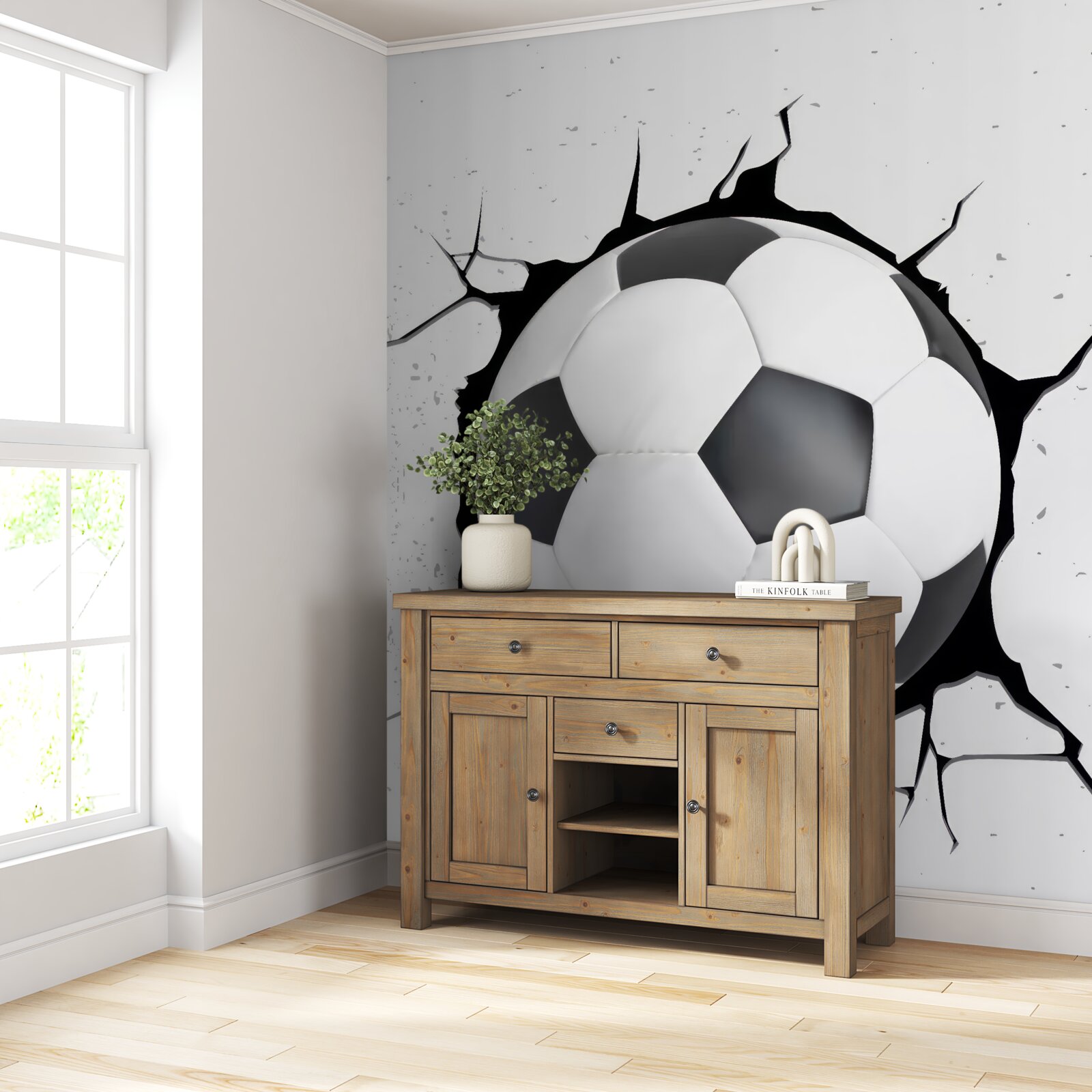 Papier peint un ballon de football dépasse du mur