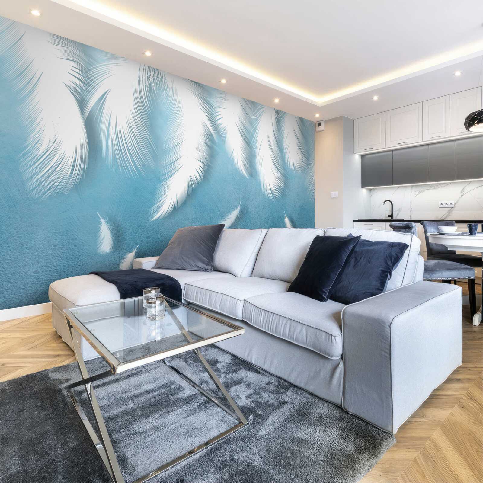 Papier peint plumes blanches tombant dans le ciel bleu