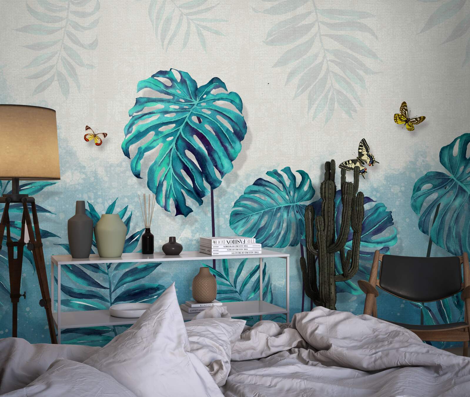 Papier peint les feuilles de monstera sont bleues, décorées de papillons